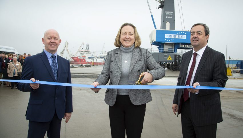 Three People Cutting Ribbon