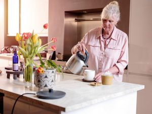 Person using electric kettle