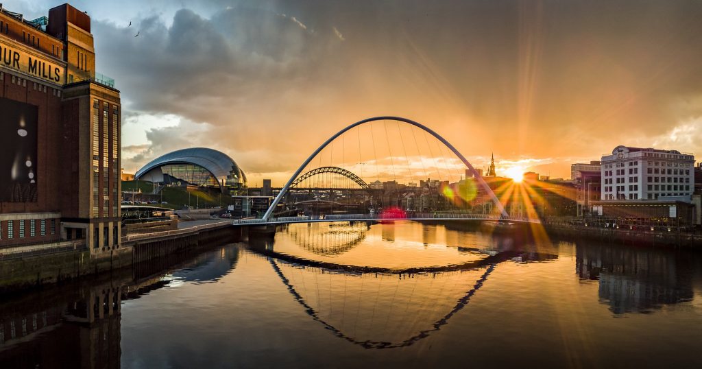 The Newcastle Gateshead Quayside pictured at sunset featuring the iconic bridges, Sage Gateshead and Baltic Art Gallery