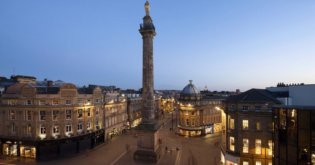Photograph of Grey's Monument in Newcastle with surrounding city skyline
