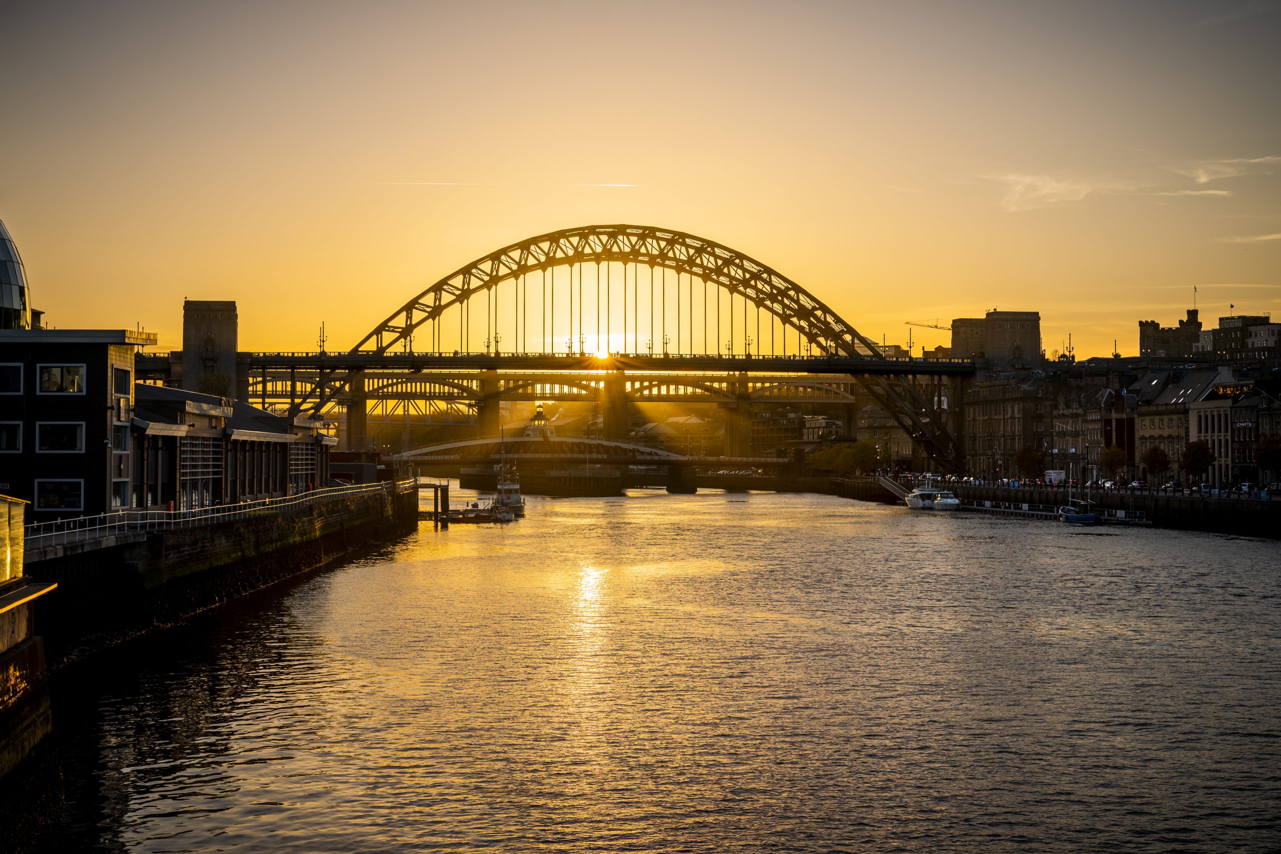 River Tyne at sunset with the Tyne Bridge in the centre of the image.