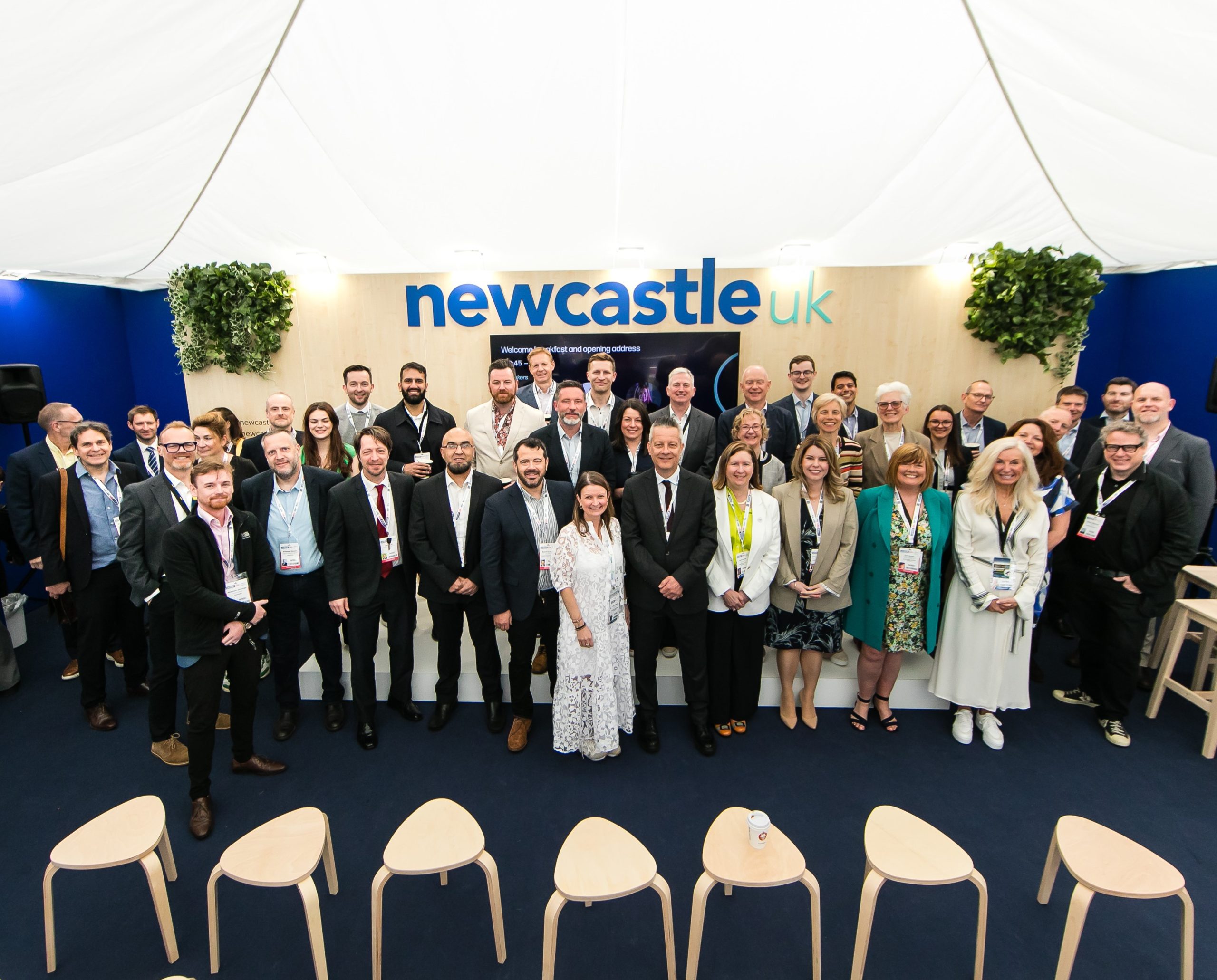 Group shot of Newcastle delegates on the Newcastle stand at UKREiIF
