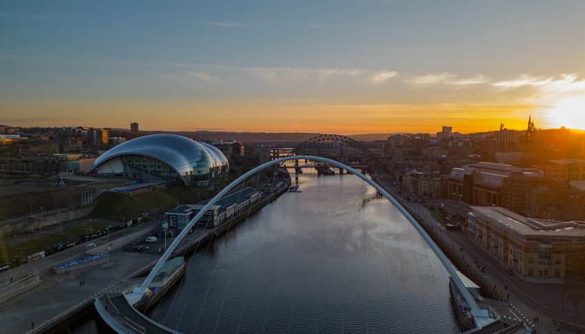 Shot on the River Tyne and the Millennium Bridge as the sun sets in the distance.