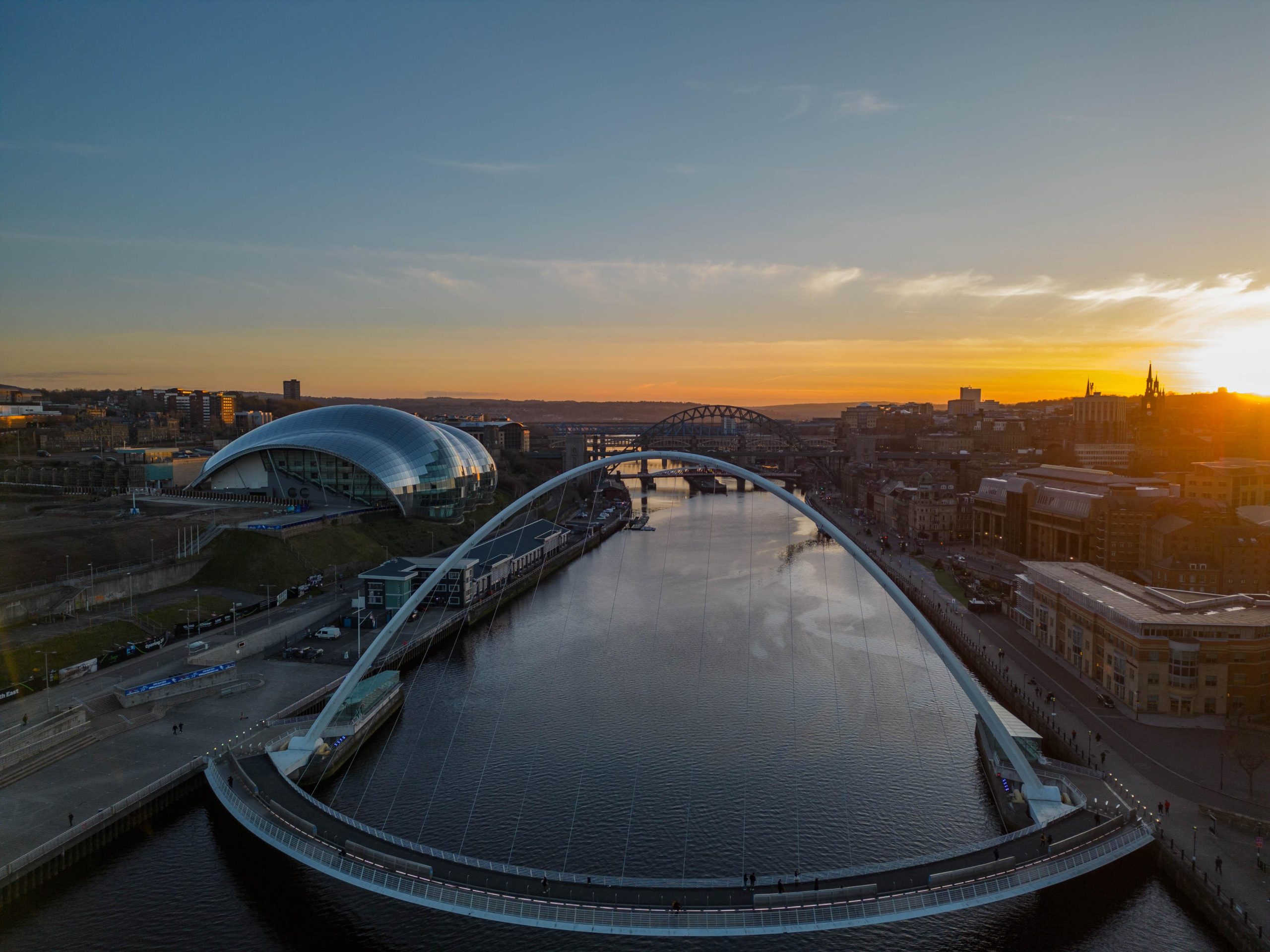 Shot on the River Tyne and the Millennium Bridge as the sun sets in the distance.