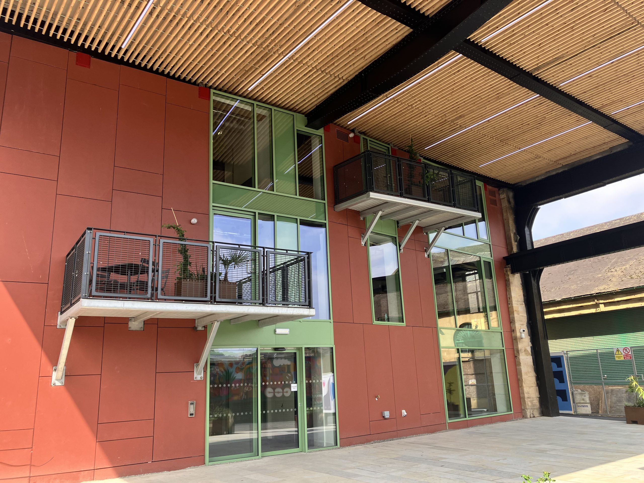 External view of the Pattern Shop with terracotta shaded walls