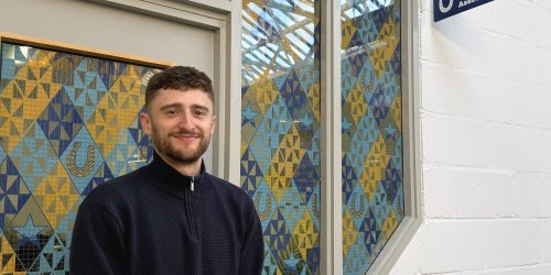 Jonny Hocke smiling outside of AMA office.
