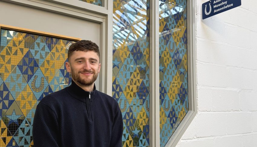 Jonny Hocke smiling outside of AMA office.