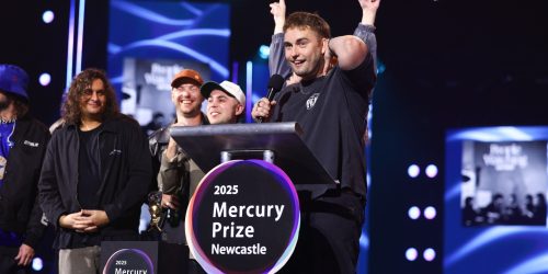 Sam Fender and his band on stage accepting the Mercury Prize