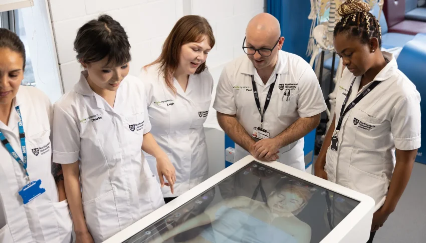Group of students receiving training by a senior medical professional